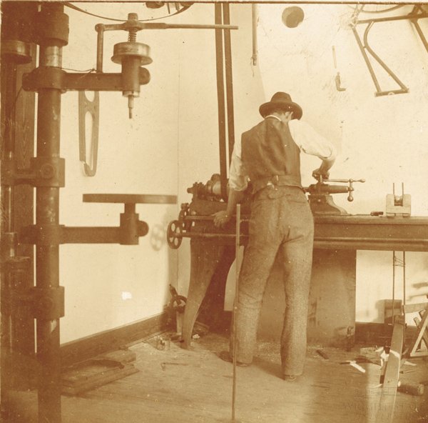 Wilbur Wright at work in the bicycle shop