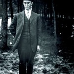 Wilbur Wright, standing, full-length, facing the camera.