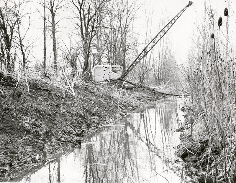 Dredge cleans and deepens old canal, 1965