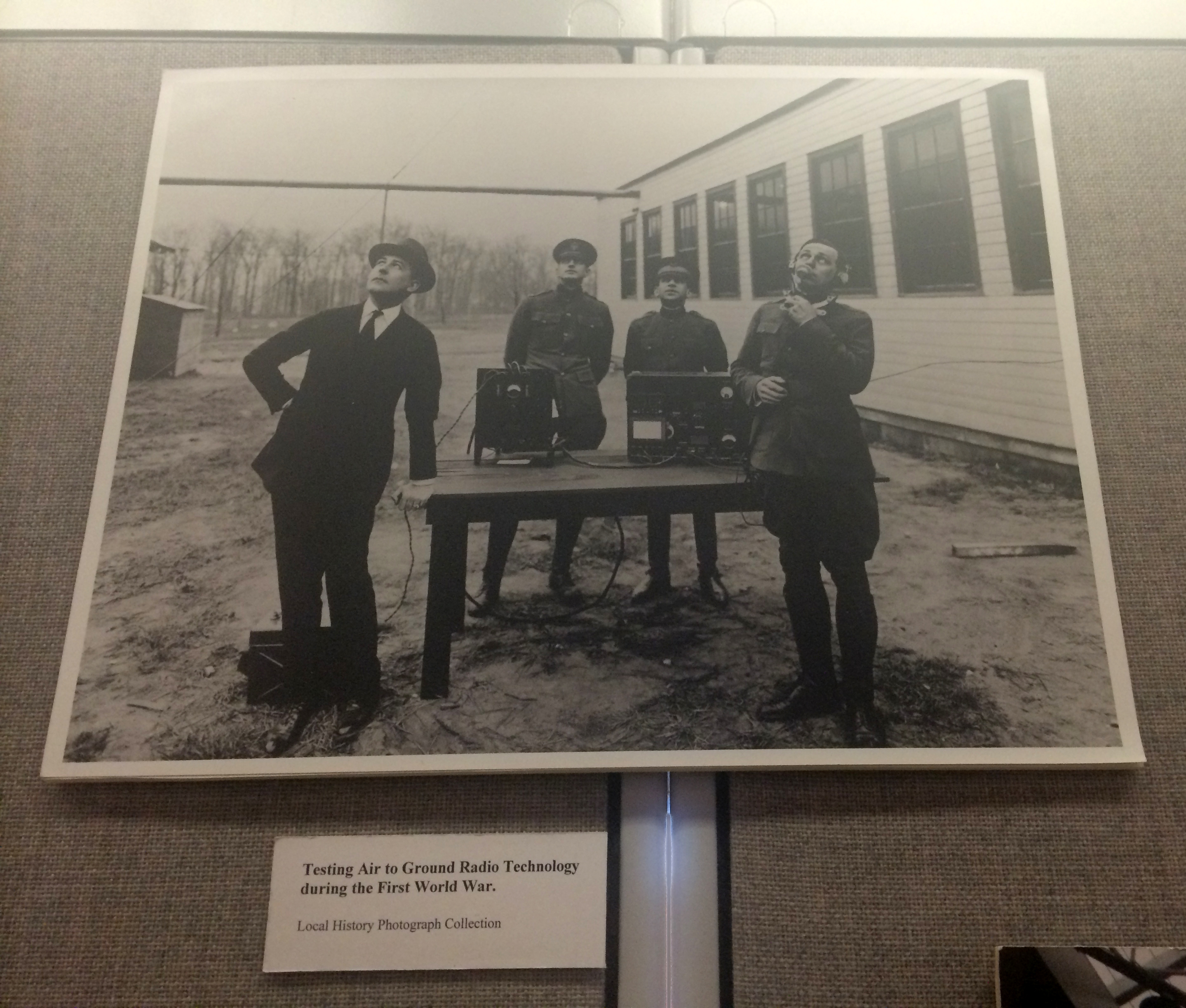 Men testing ground-to-air radio transmissions during World War I, undated, from the Local History Photographs collection. This copy hangs on the walls of our offices.