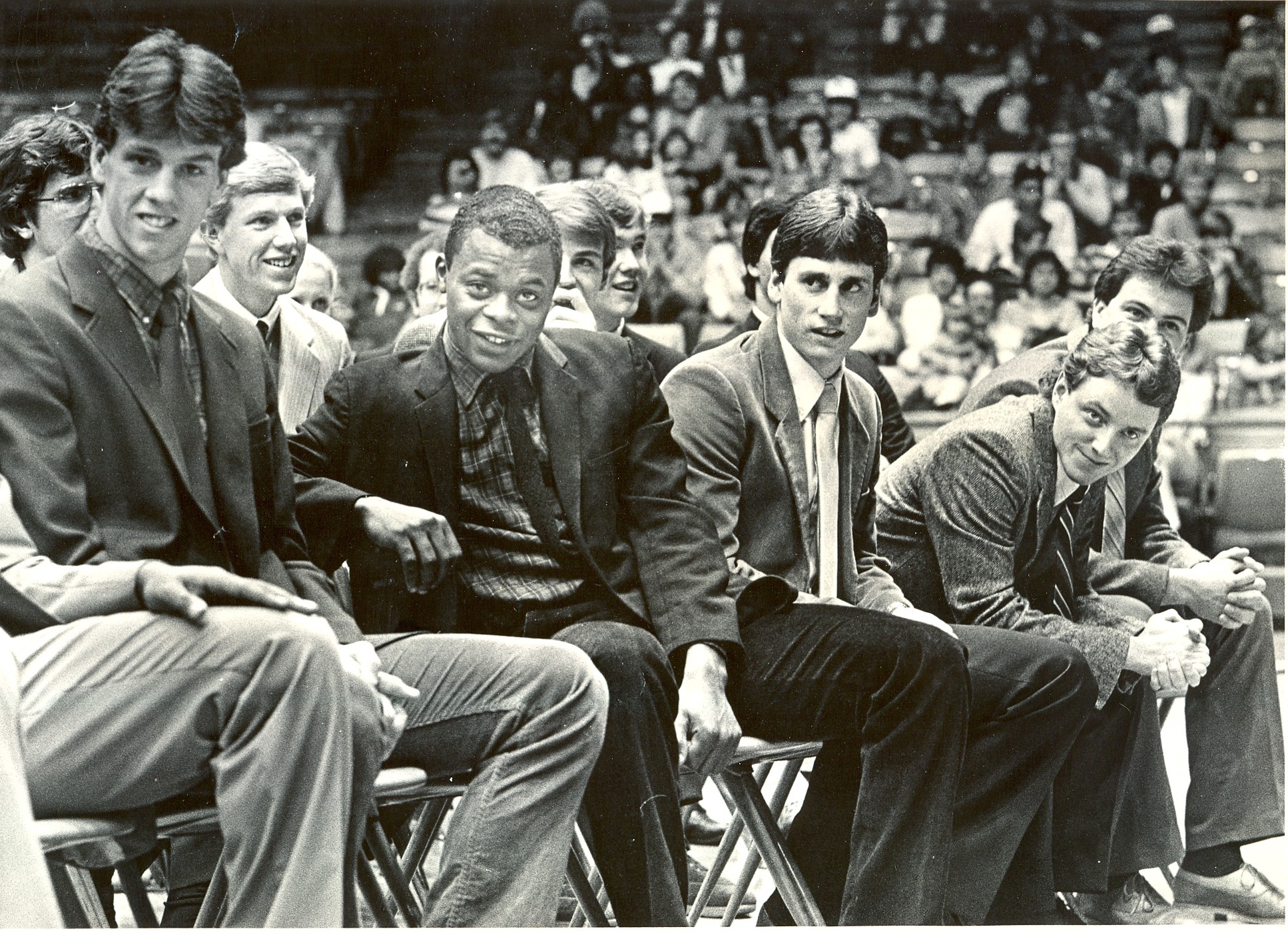 Mar. 26, 1984. UD Basketball team members wear smiles on their faces as they sit before a crowd of more than 3,000 at UD Arena. From left: Larry Schellenberg, Rory Dahlinghaus, Cedric Toney, Dan Christie. 