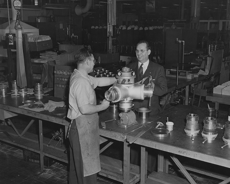W. J. Blanchard (right) with a factory worker, undated (Photo by GM Aeroproducts, MS-305, Box 3a, Folder 9)