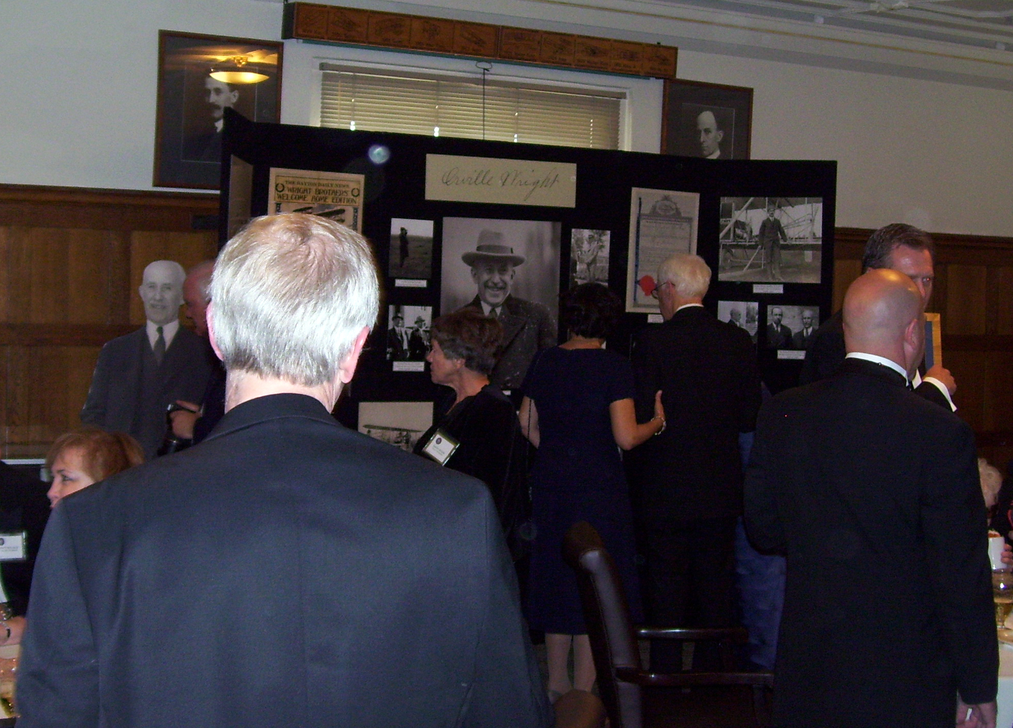 Attendees at the centennial celebration enjoying the exhibit, April 26, 2014
