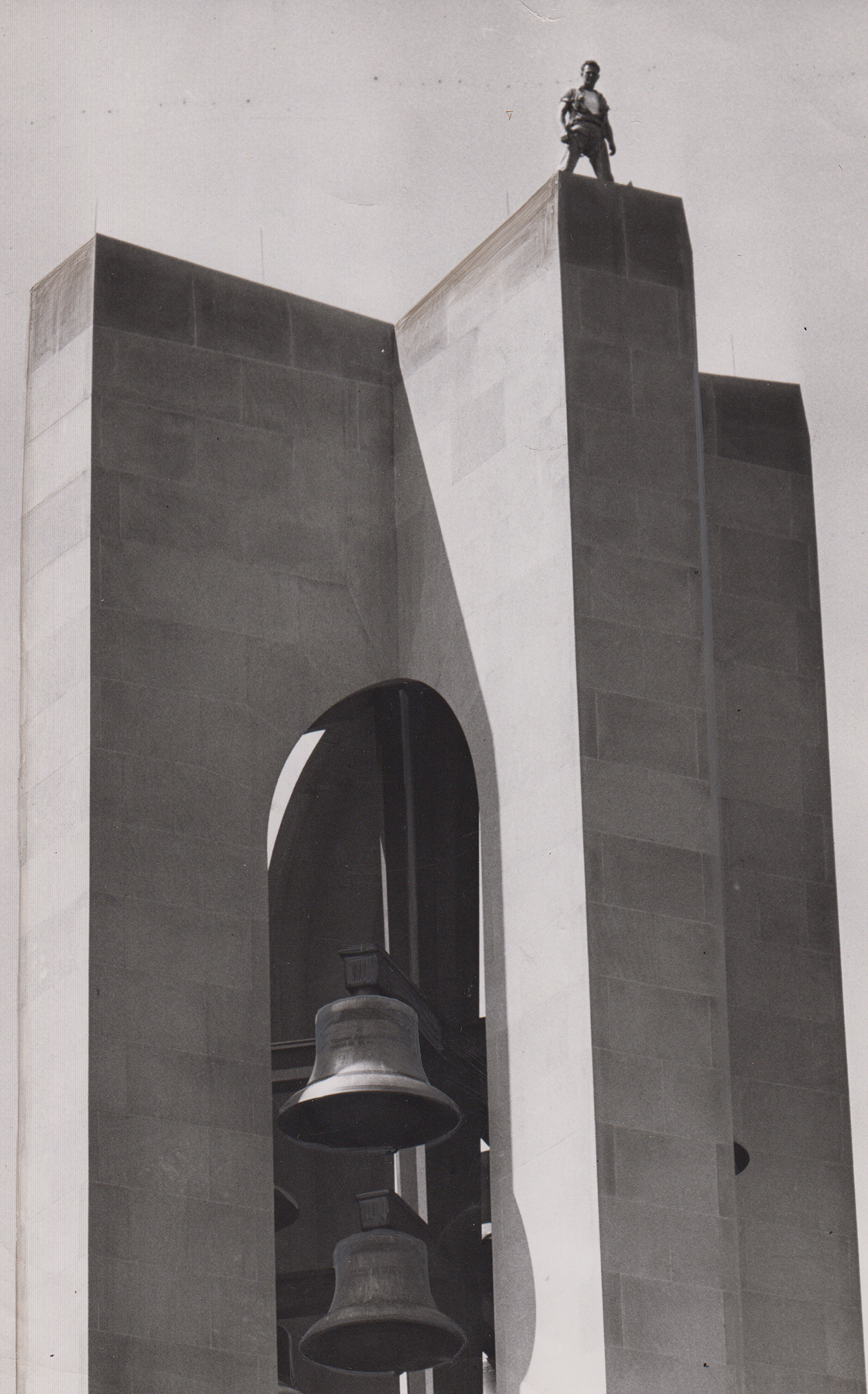 Worker atop Deeds Carillon, ca. 1940s