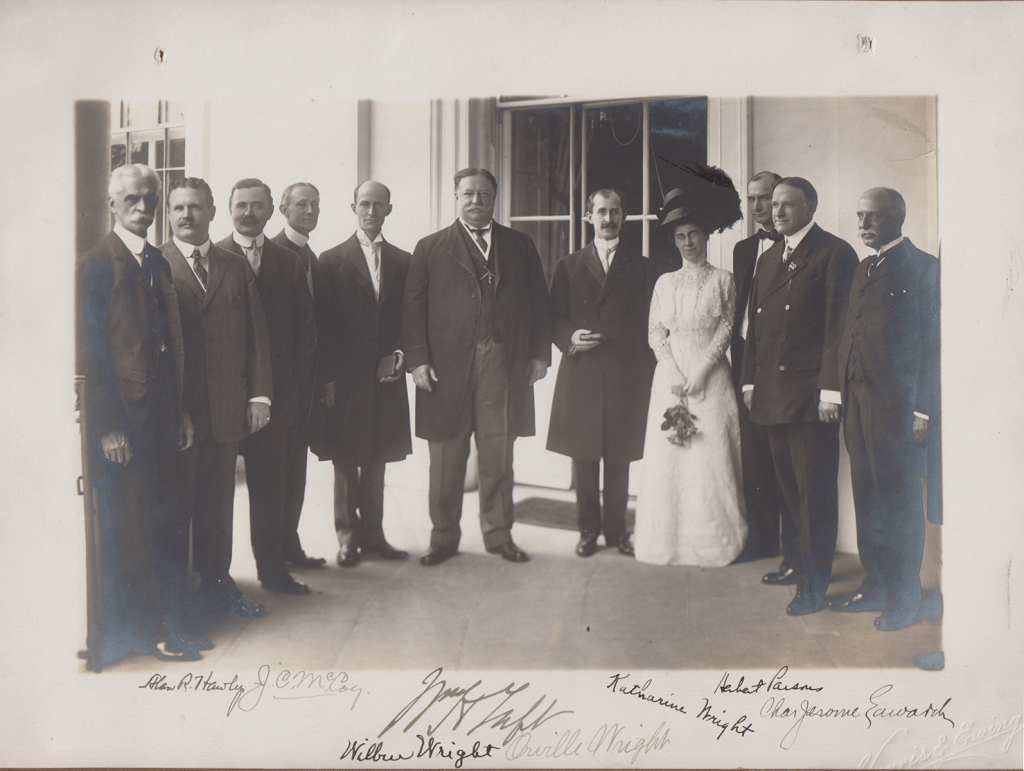 President Taft, center, with Wilbur Wright (left) and Orville Wright and sister Katharine (right) and other important gentlemen, at the White House, June 10, 1909. (MS-1)