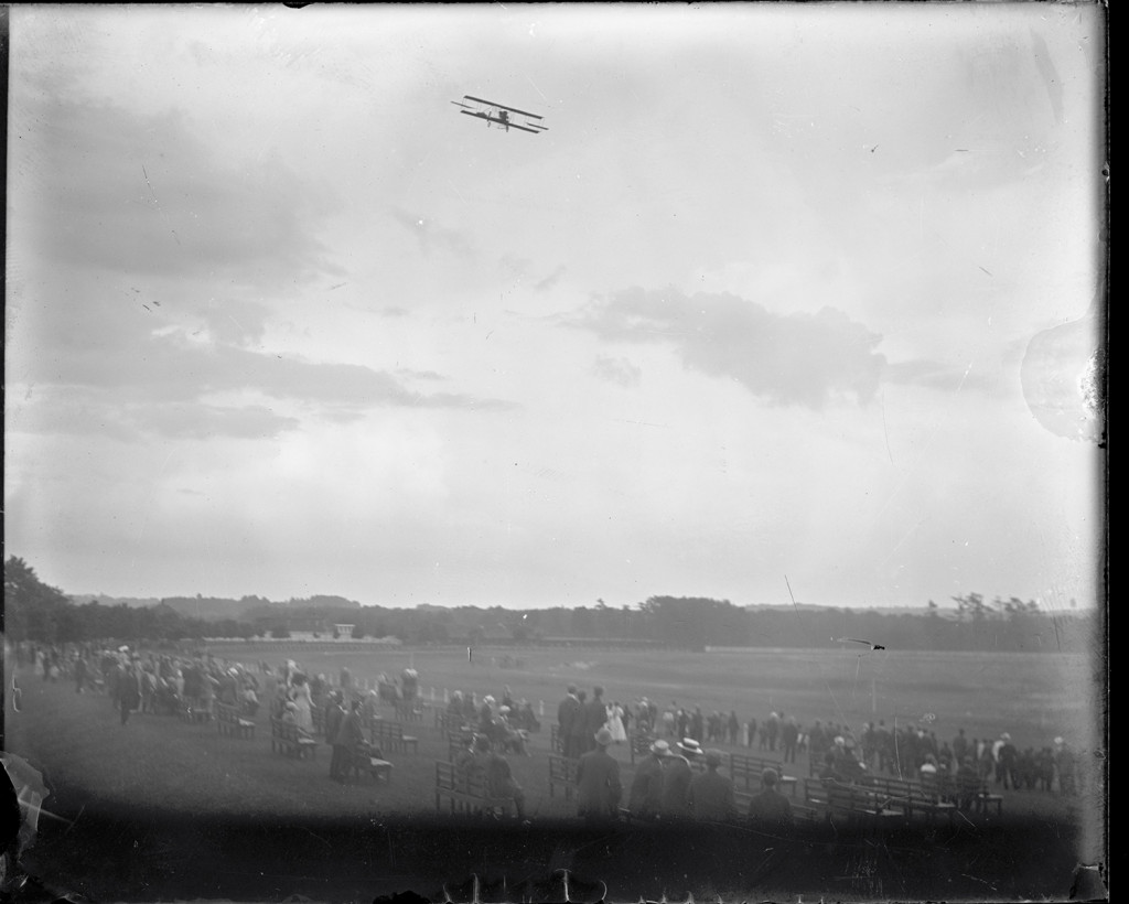 Lincoln Beachey flying a Curtiss aircraft over the racetrack at Saugus, Massachusetts., during the  Harvard-Boston Aero Meet, Sept. 1911. From the Harvard Boston Aero Meet Collection, photo # MS338_03_12. More on CORE Scholar.