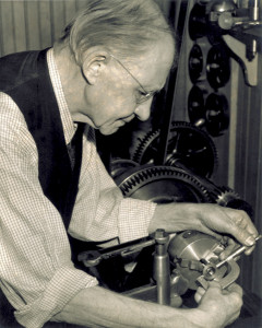 Charlie Taylor checking an engine part on the half-scale reproduction of the 1903 engine he built for the Edison Institute (now Henry Ford Museum and Greenfield Village), 1937. (photo ms1_21_4_13)
