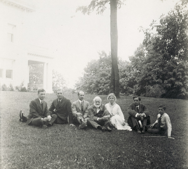 Group sitting on the lawn of the Wright Hawthorn Hill home, 1915. Left to right: Pliny Williamson, John R. McMahon, Orville, Bishop Milton, and Katharine Wright, Earl N. Findley, and Horace Wright. (photo ms1_26_5_7)