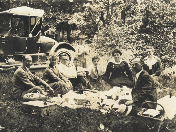 Wright family picnic, 1915. Left to right: Orville Wright, Katharine Wright, Milton Wright, William Jenkins, James "Jim" Jenkins (standing); Horace "Bus" Wright, Lottie Andrews, Ivonette "Netta" Wright, and Lorin Wright. This image is attributed to Mayfield Photos, Inc., Dayton, Ohio. (photo ms1_29_2_1)