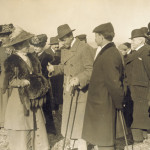 Katharine Wright speaks to Alfonso XIII, King of Spain, as Orville Wright, Mrs. Hart O. Berg, and others stand nearby, 1909. (photo ms1_18_1_17)