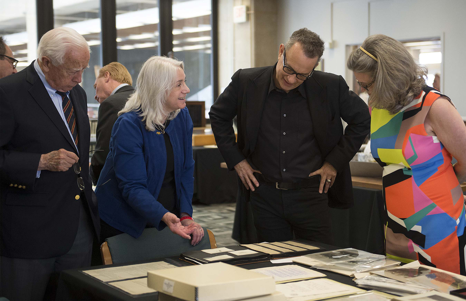 Dawne Dewey, Head of Special Collections & Archives, second from left, shares items from the Wright Brothers Collection with historian David McCullough (left), Tom Hanks, and Amanda Wright Lane, great-grandniece of the Wright Brothers. (Photo by university photographer Will Jones)