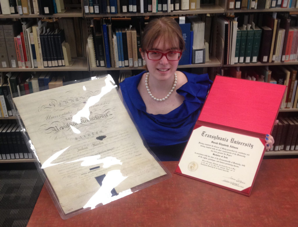 Sarah Allison, the author, displays Dr. Martin's Transylvania University diploma from 1826 on the left, alongside her own Transylvania University degree certificate from 2015, on the right.