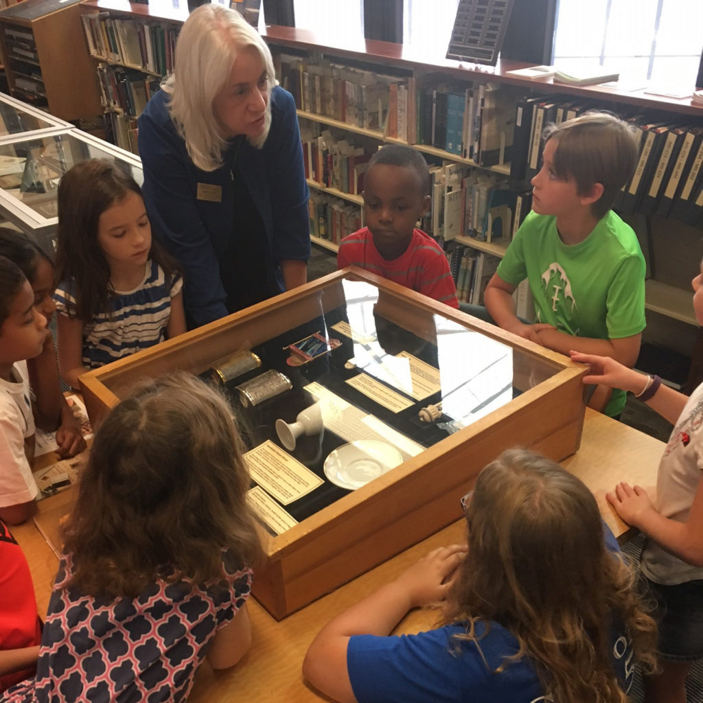 Checking out our small exhibit of Jewish artifacts (photo courtesy of the camp teacher)
