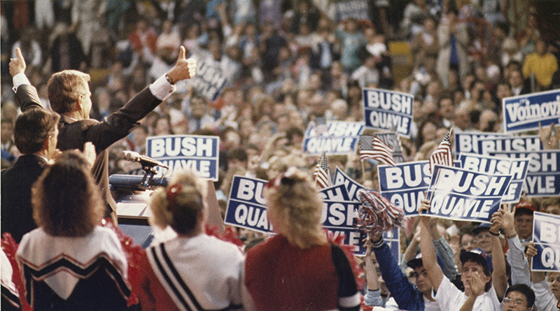 George H. W. Bush gives two thumbs up to the enthusiastic crowd at Hobart Arena in Troy, Oct. 1988