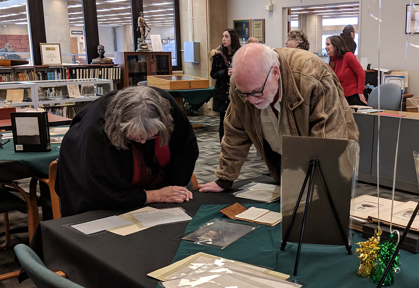 Visitors reading the Bishop's diaries and letters