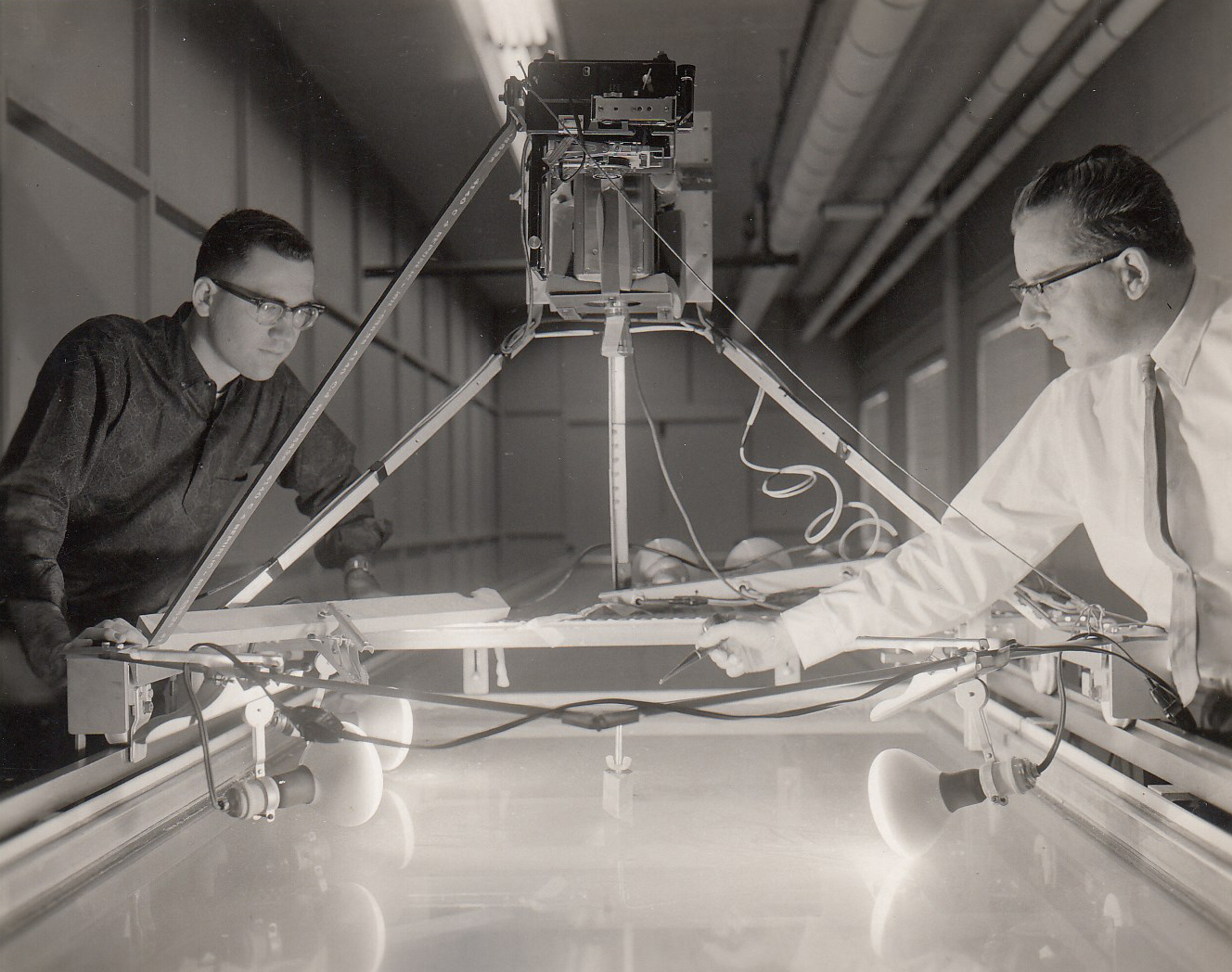 Berndt (right) and water tunnel used in parachute development, WPAFB, 1962 (Box 4, File 7)