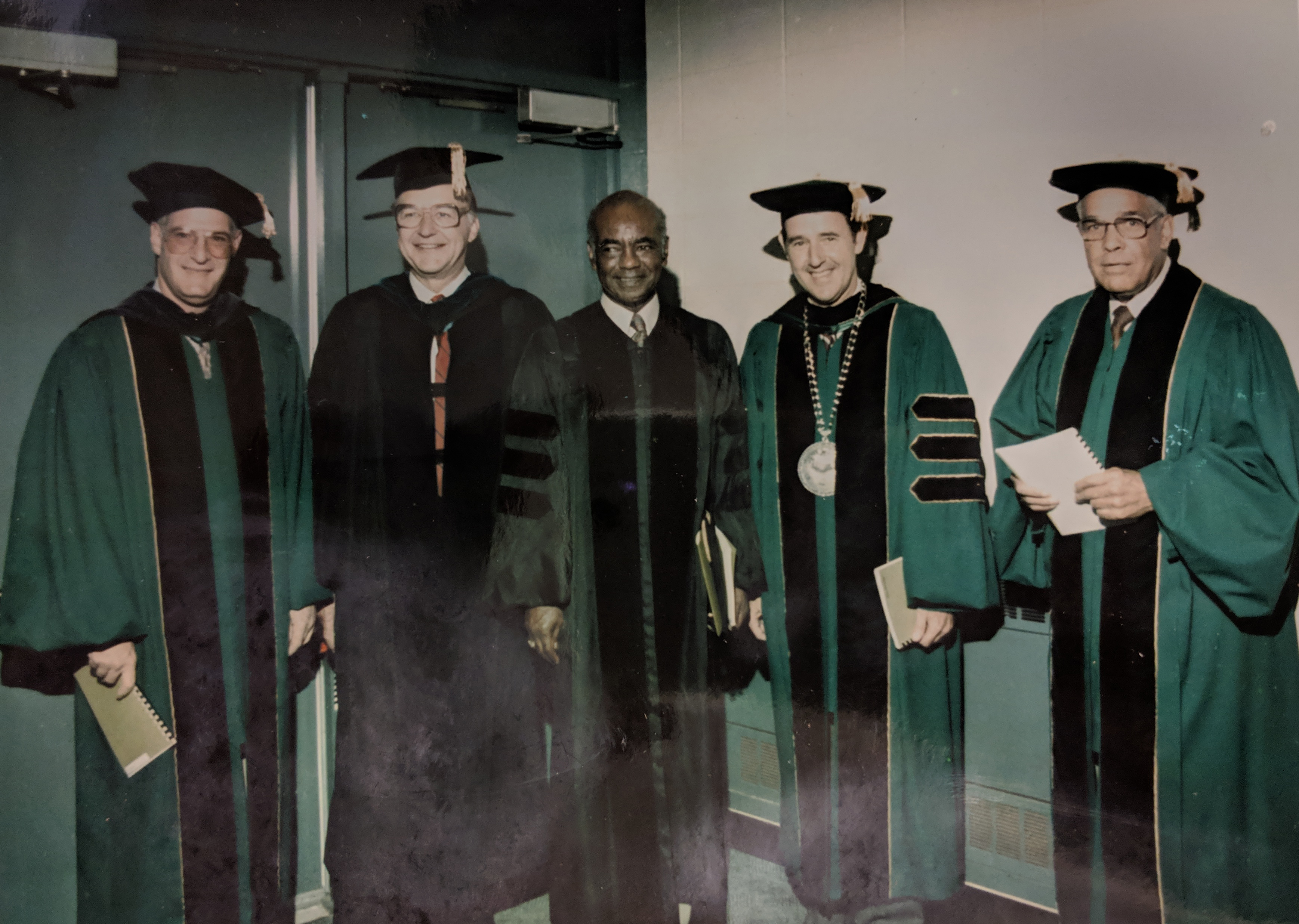 C.J. McLin, Jr. (center), on the occasion of receiving an honorary Doctor of Humane Letters degree from Wright State University; WSU President Paige Mulholland is second from right.