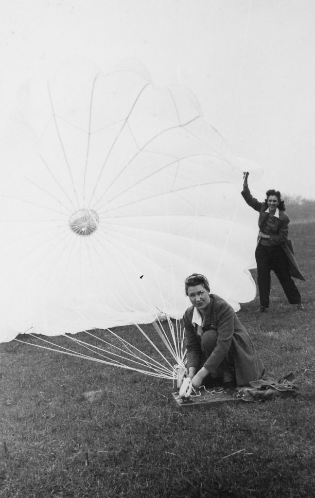 Women with parachute, undated