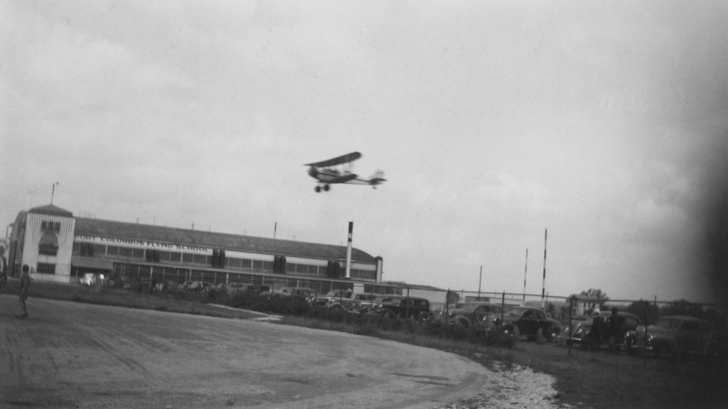 Port Columbus Flying School, with aircraft in air, undated