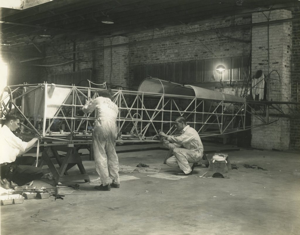 Gates Aircraft Corporation factory workers with fuselage (ms646_sb3_p31)